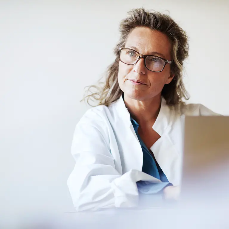 Female doctor behind a laptop