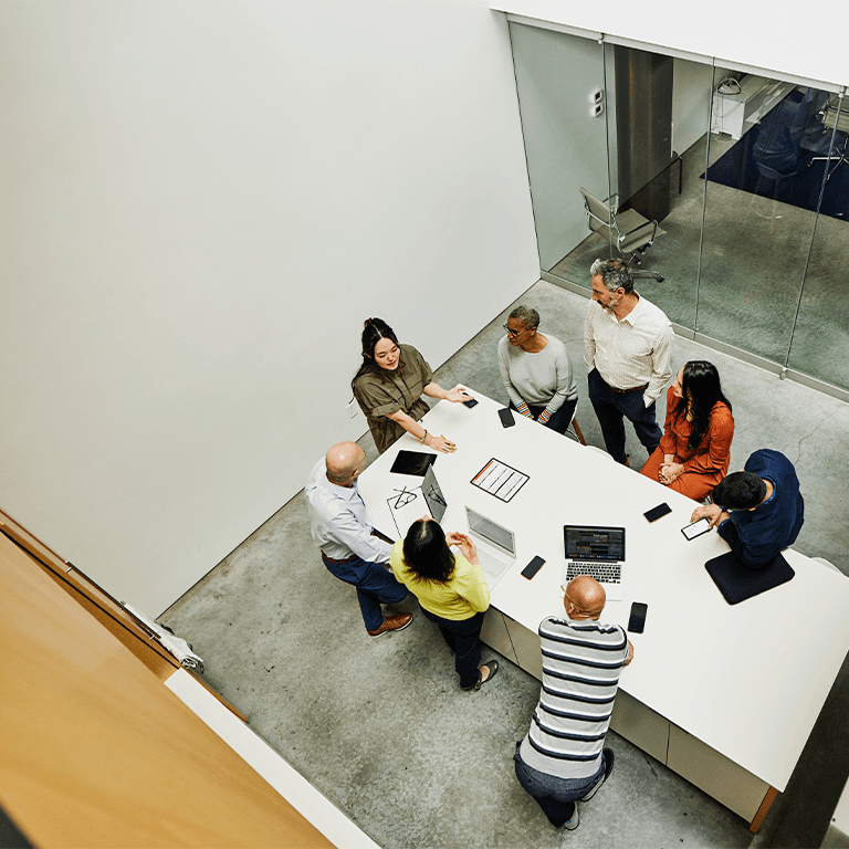 a meeting at a long conference table