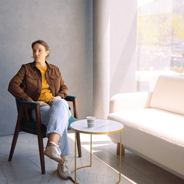 woman sitting at a coffee table