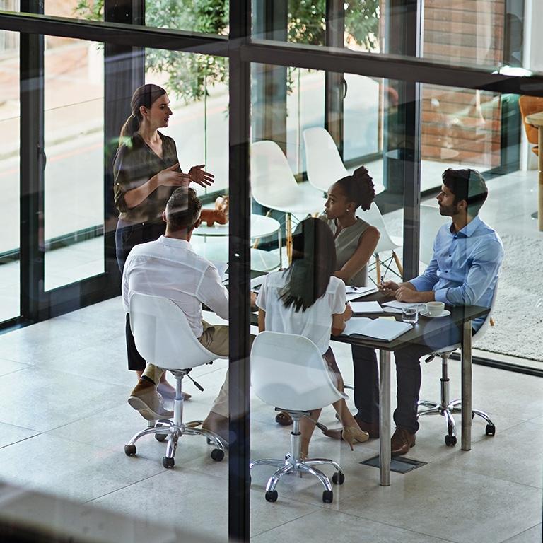 people gathered at a conference table