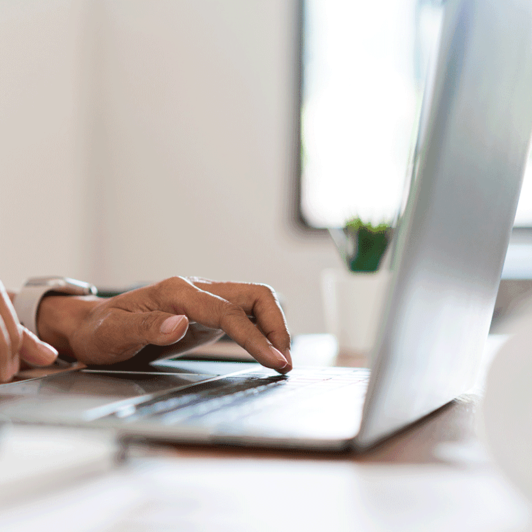 hand on laptop keyboard