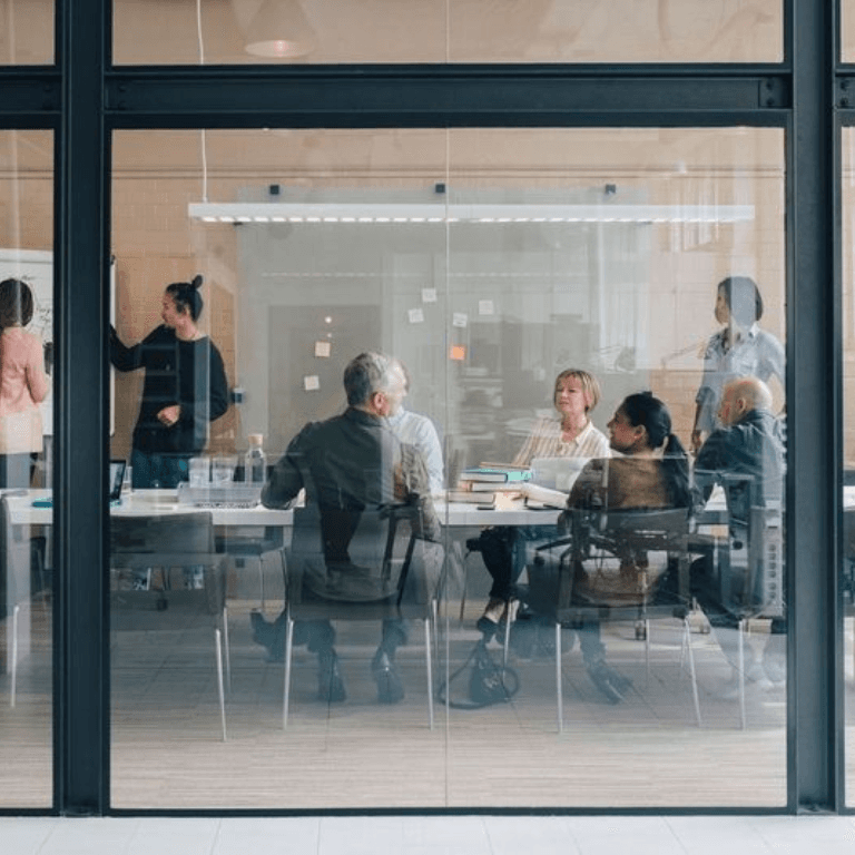 people having a meeting around a table