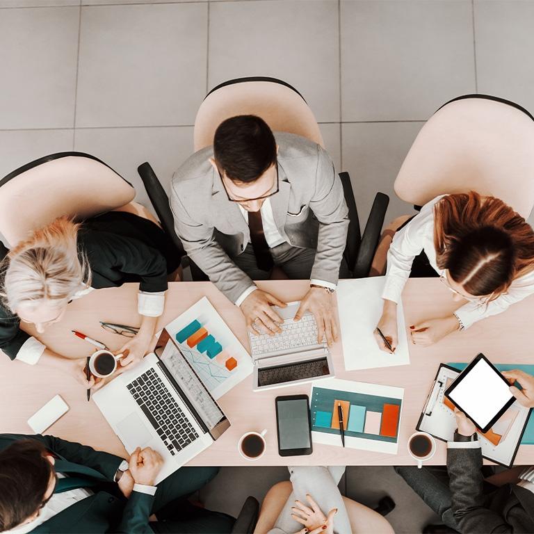 birds eye view of people working on laptops