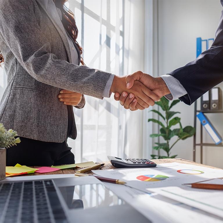 hands shaking over a desk