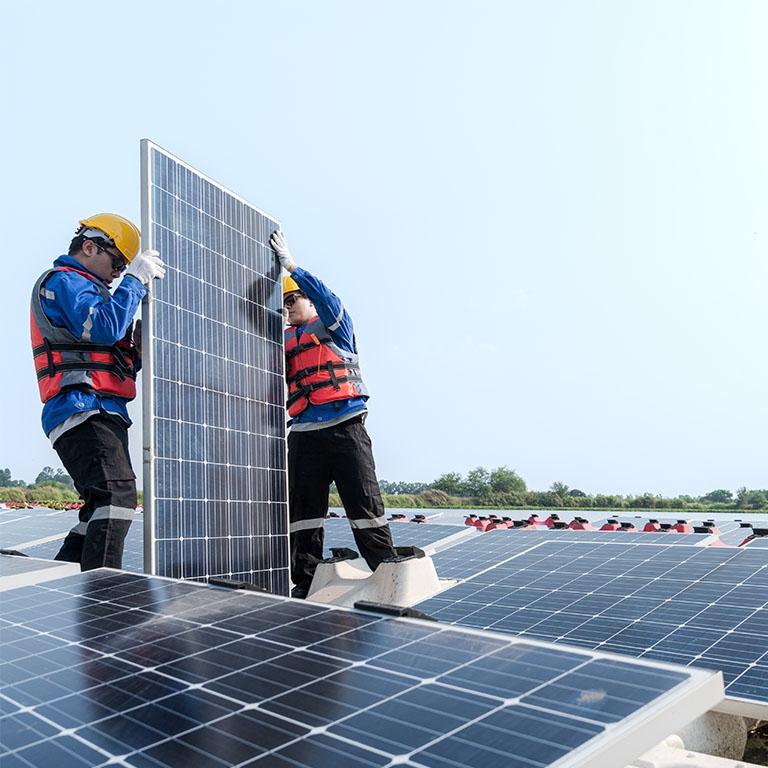 workers interacting with solar panels