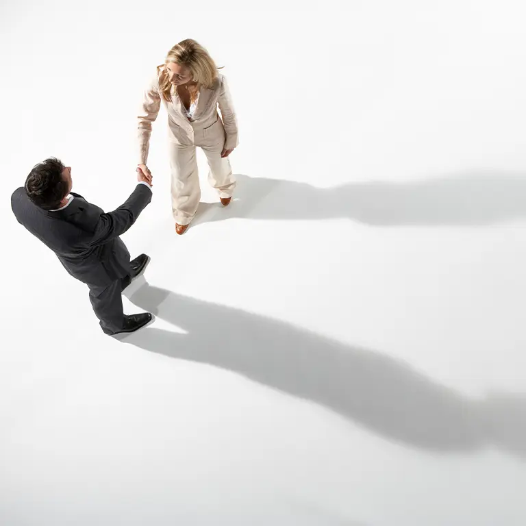 two people shaking each others hand