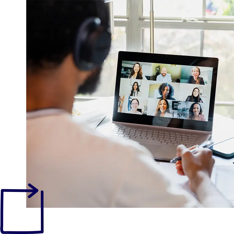 Man looking at a computer during a virtual meeting
