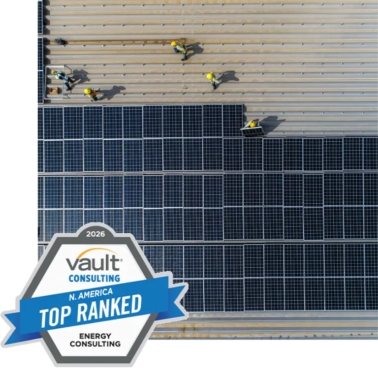 image of people working on solar panels with vault top energy consulting award logo in foreground