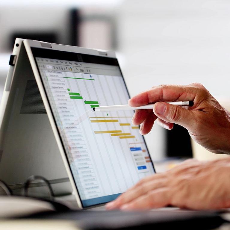 person interacting with a pencil in a tablet