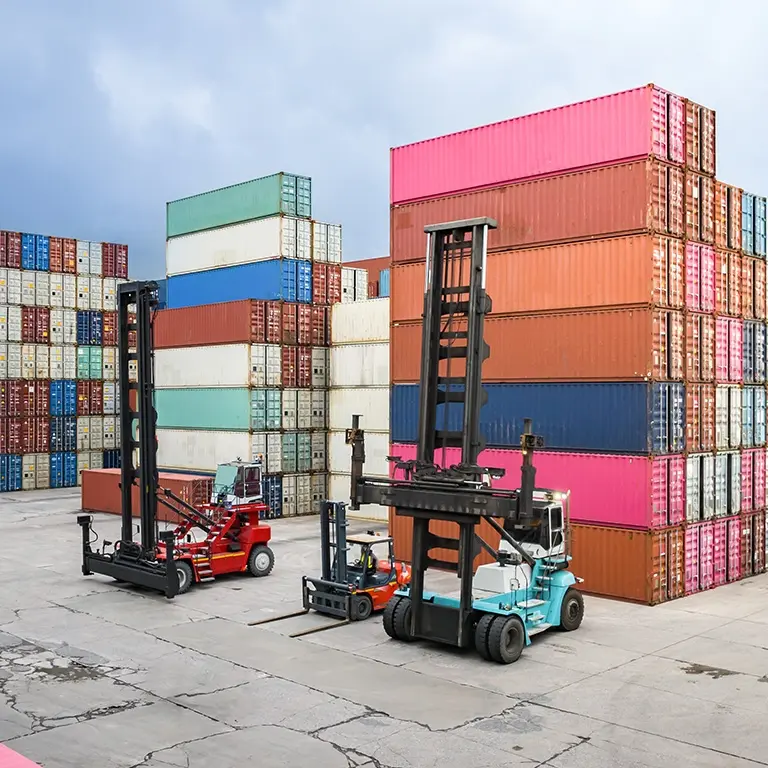 shipping containers stacked at shipping yard