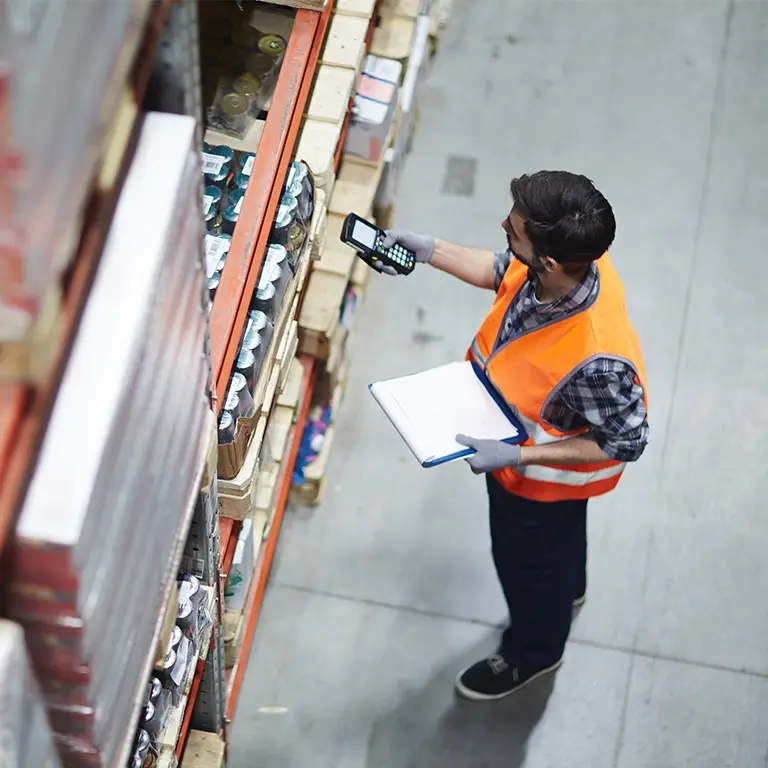 retail backroom employee taking inventory