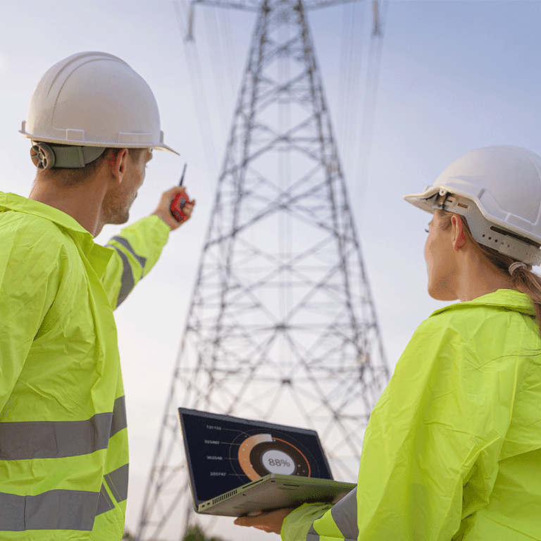 co workers working on a powerline