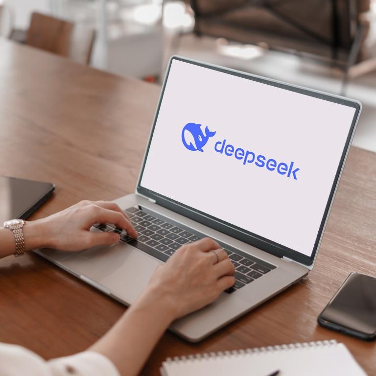 a woman using deepseek on her laptop
