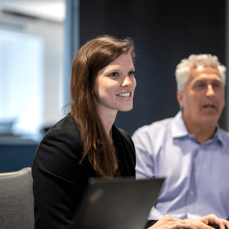 woman in meeting smiling