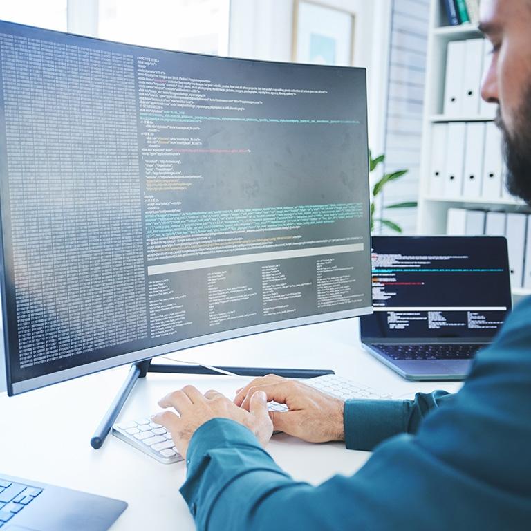 man typing on a computer