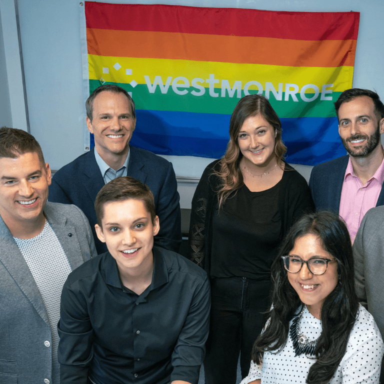 Group of people in front of a West Monroe pride flag