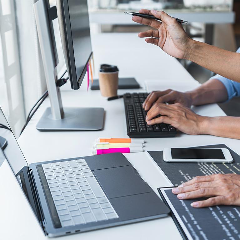 people typing on a computer