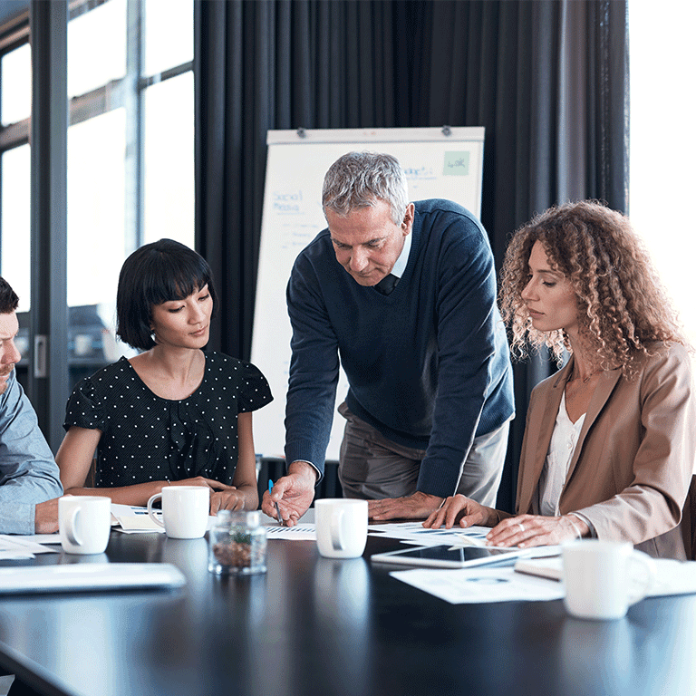 co workers gathered around a table