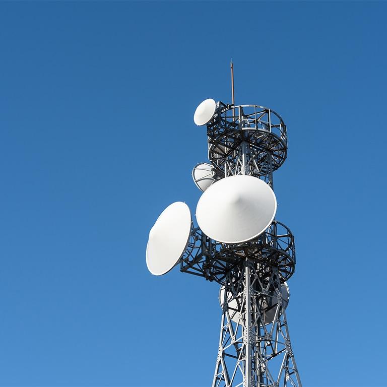 telecom tower against blue sky