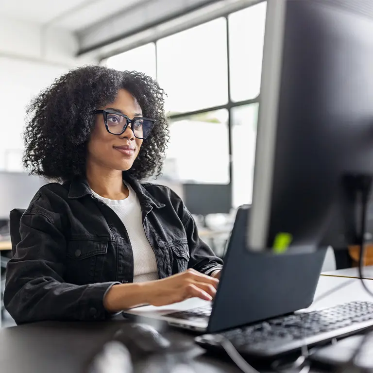 woman working at a desktop