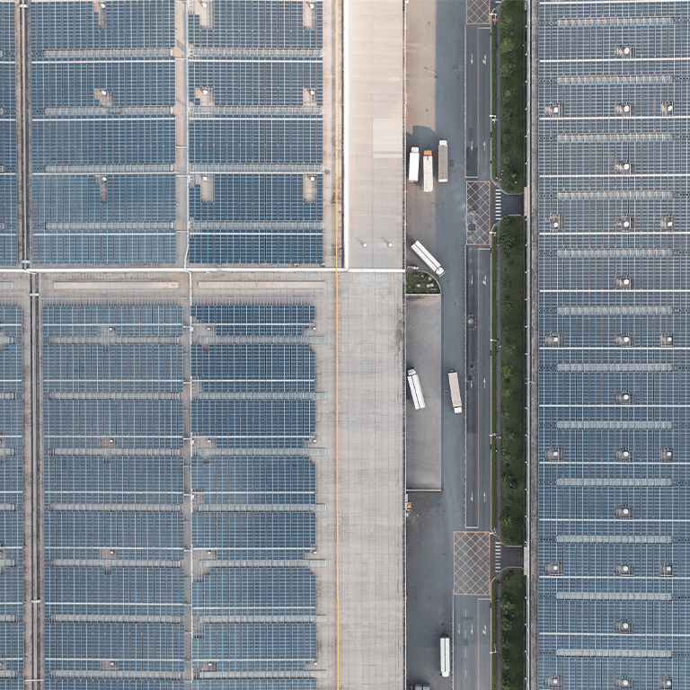 solar panels and trucks in a loading dock