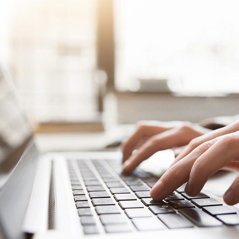 person typing on computer