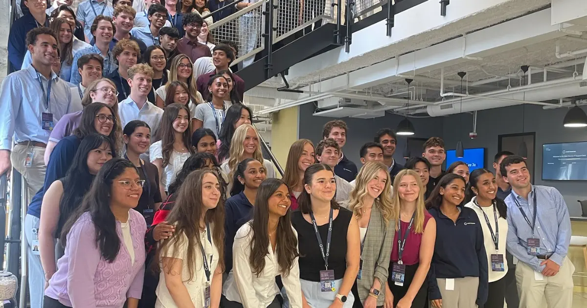 west monroe 2026 intern class standing on the steps in the west monroe chicago office