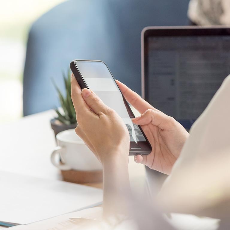 hands holding smartphone