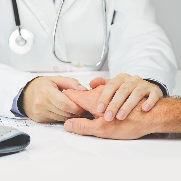 doctor holding someone's hand